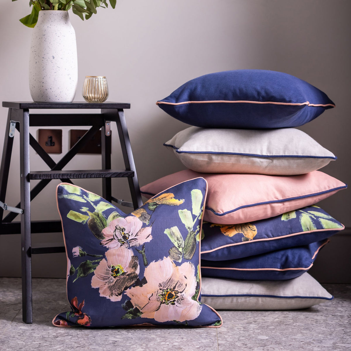 Navy and blush store cushions