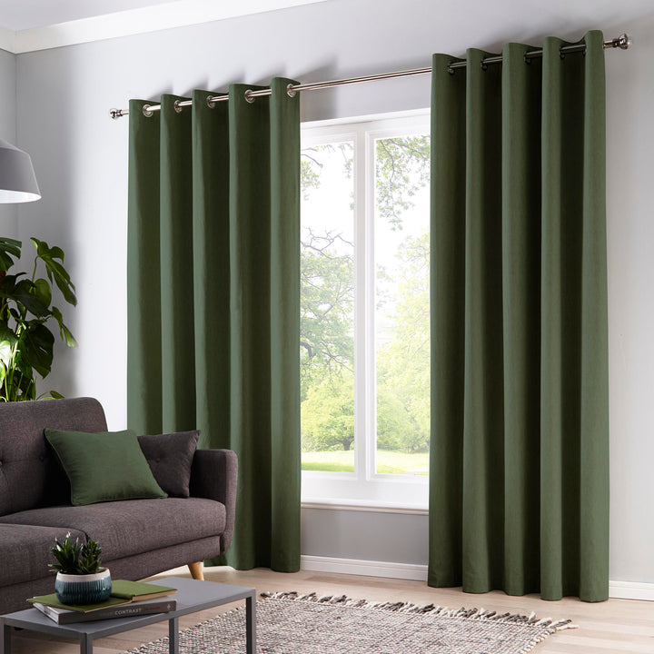 Cannes Pair of Eyelet Curtains by Fusion in Bottle Green